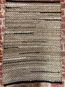 Brown rag rug with diamond weave