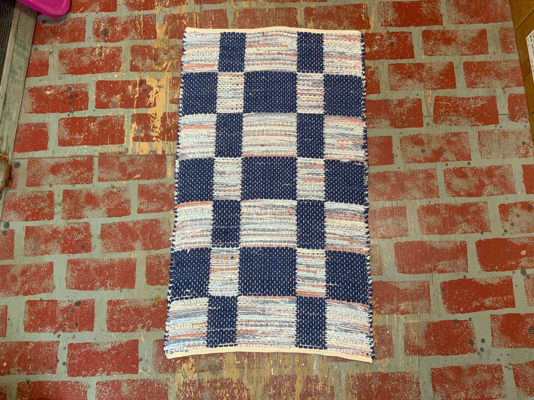 523-8.   23 x 39  Navy & shirt prints block weave