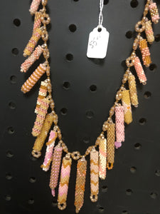 Pink, rose, and gold colored beaded necklace