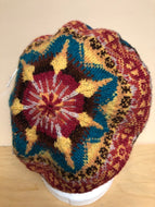 Red, yellow, and blue wool tam hat