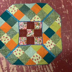 Pieced table topper 22”