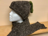 Hand-knit brown hat with green tassel and matching scarf