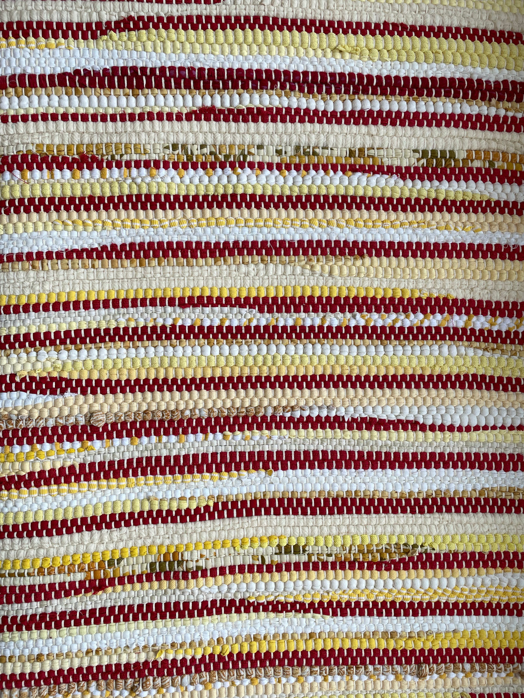 Red and yellow 28” x 41” rag rug