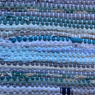 Pale blues, turquoises, greens, gray, cream,