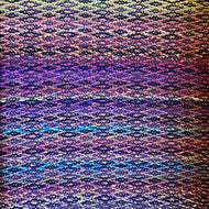 Multicolored Noro yarn with purple and blue yarn background 28”x45”