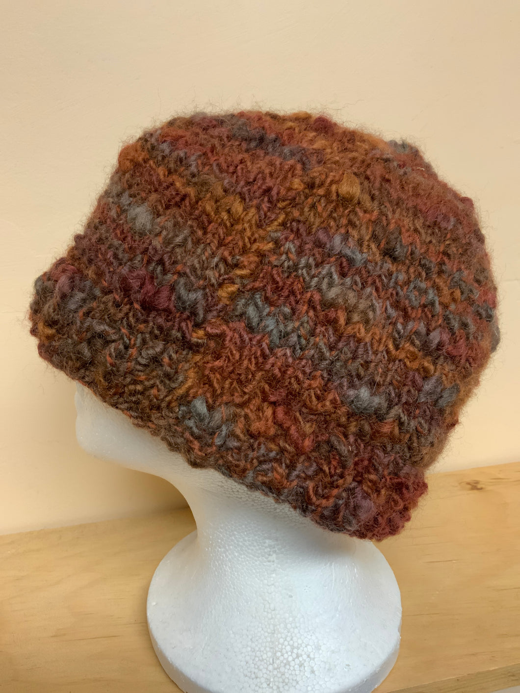 Hand-knit wool hat in shades of brown
