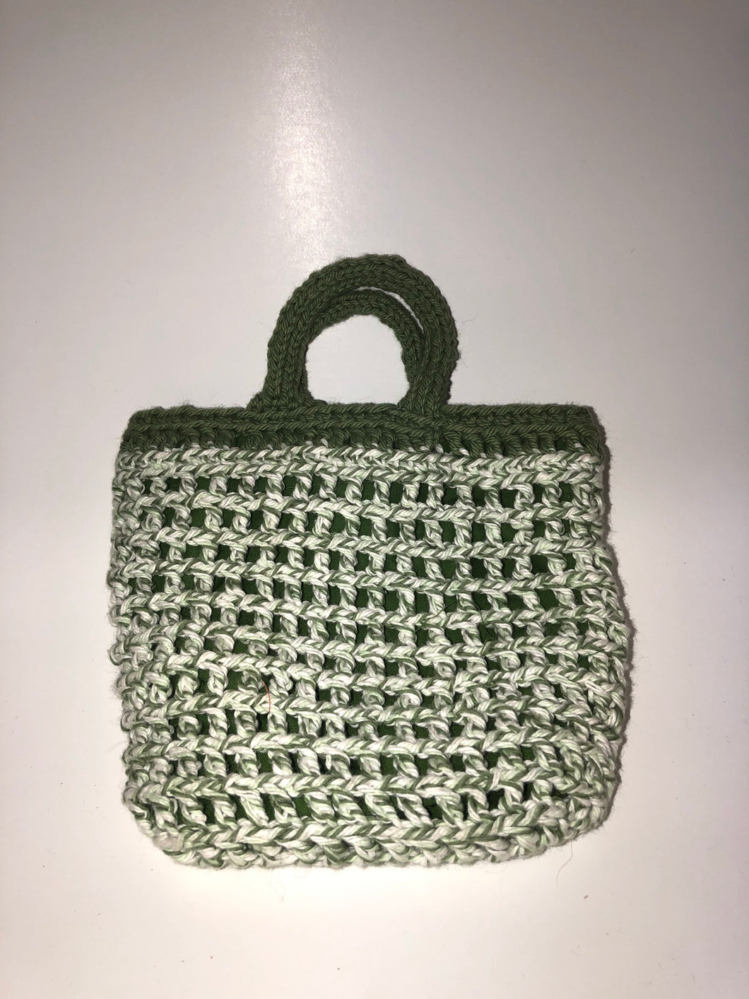 White and green knit bag with green lining