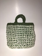White and green knit bag with green lining