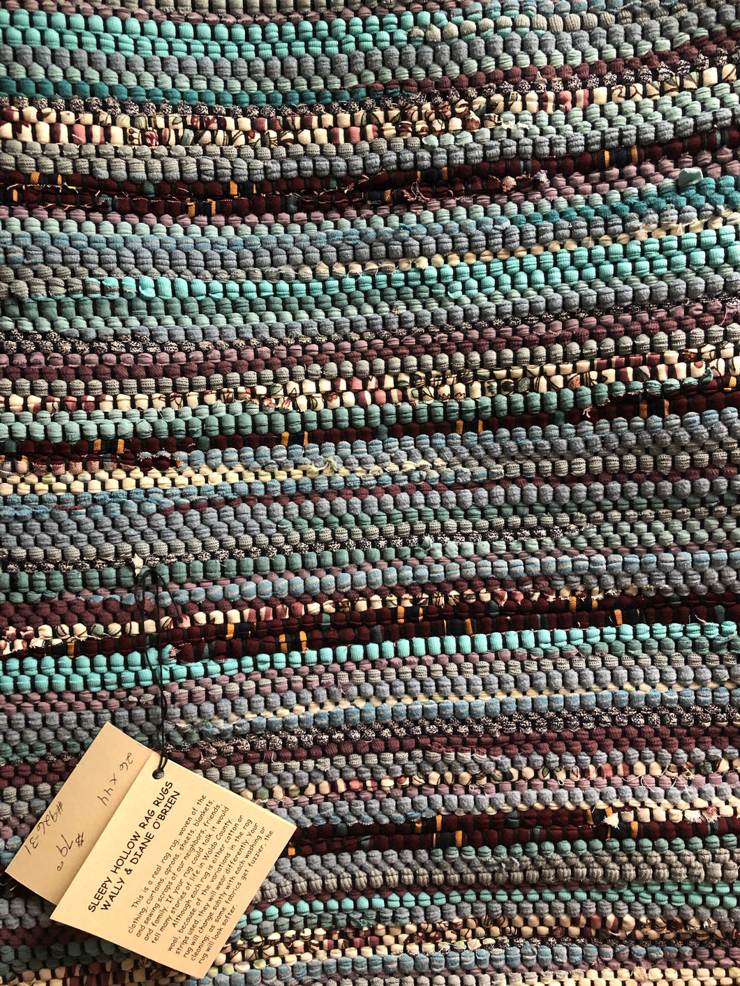 Blue and maroon 26” x 44” rag rug