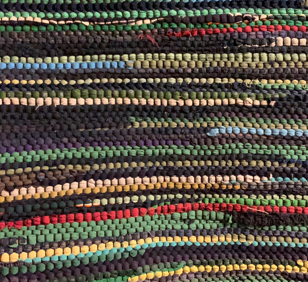 Navy and green rug, 34” x 54”