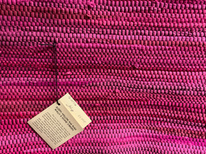 Bright pink 24” x 37” rag rug