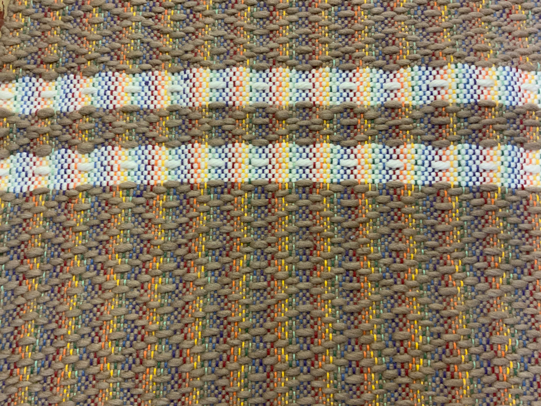 Brown wool diamond pattern with white wool stripes on rainbow warp: 26” x 43”