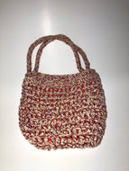 Red and white knit bag with orange lining