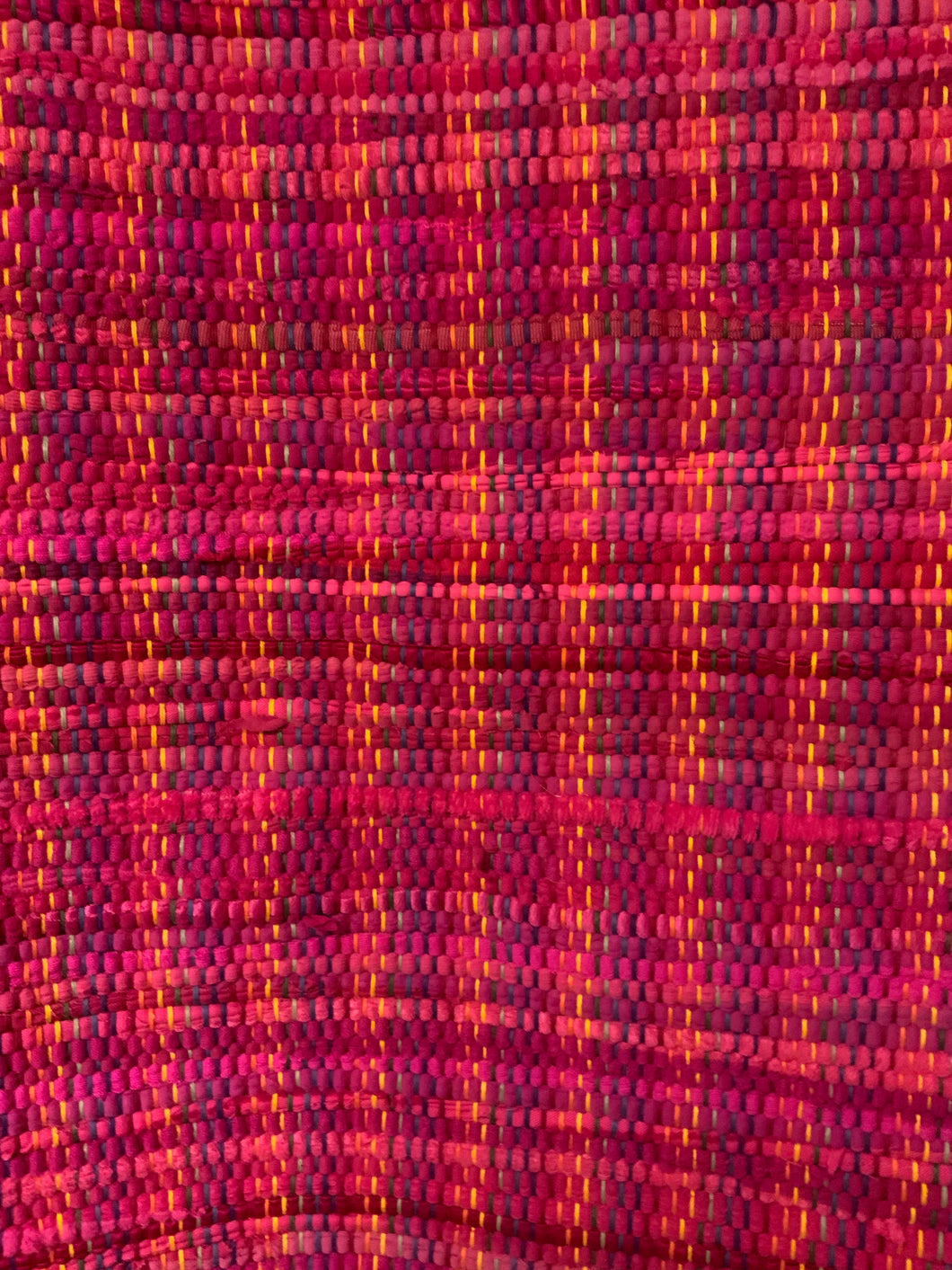 Pink rag rug on rainbow warp: 28” x 44”