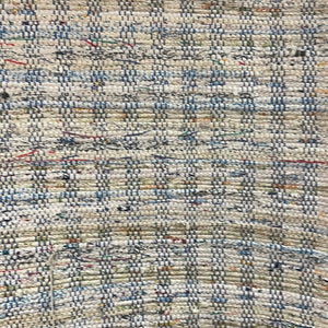 24” x 39” a white rug with specks of color, blue and white warp
