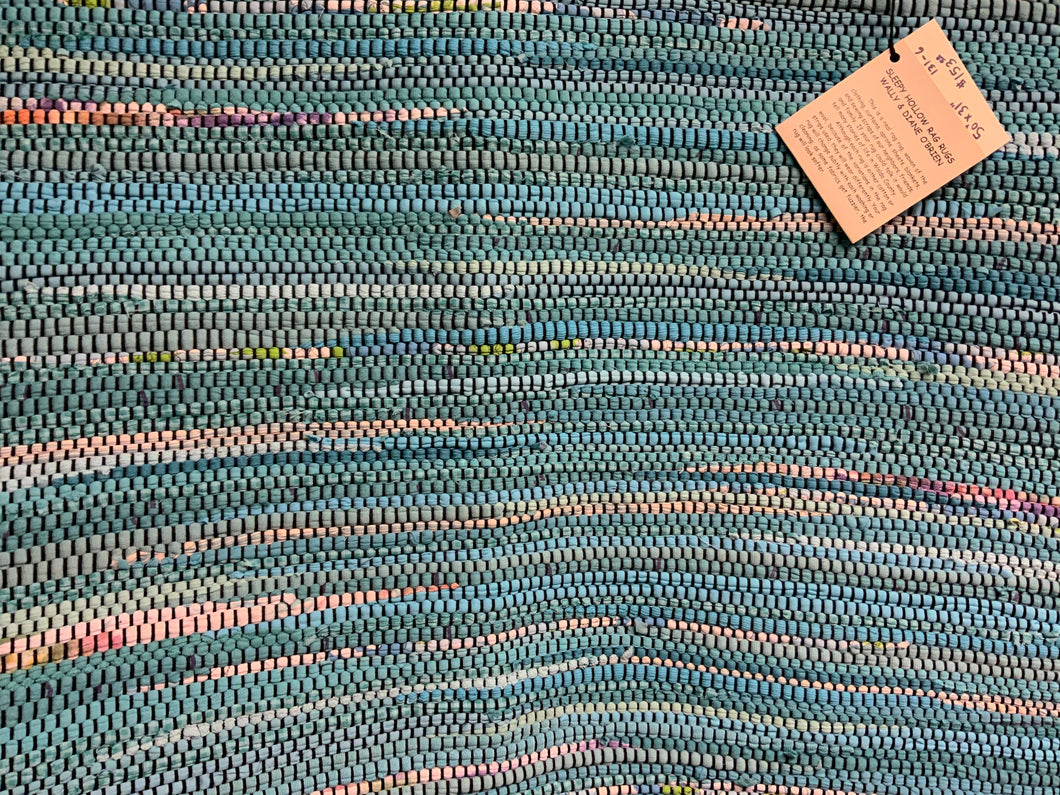 Teal rug on black warp; 50” x 31”