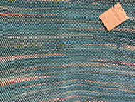 Teal rug on black warp; 50” x 31”