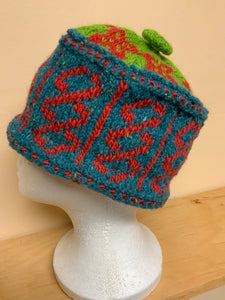 Green, teal, and red wool knit hat