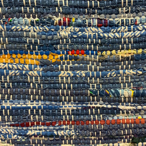 Blues, denims with red, yellow and white highlights. 24” X 39”