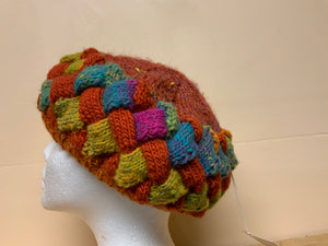 Rust and green knitted hat