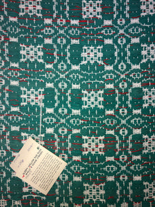 Green rug with overshot pattern 24” x 44”
