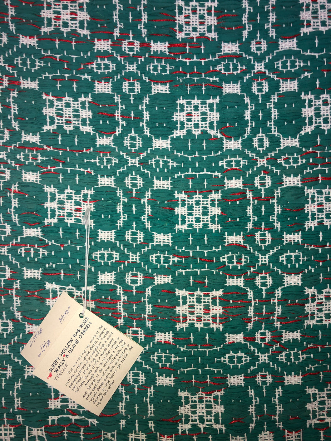 Green rug with overshot pattern 24” x 44”