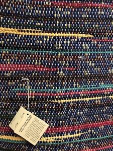 Navy blue with stripes of yellow and red 30” x 48” rug
