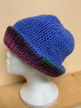 Load image into Gallery viewer, Hand-knit reversible hat, blue on one side, purple shades on the other
