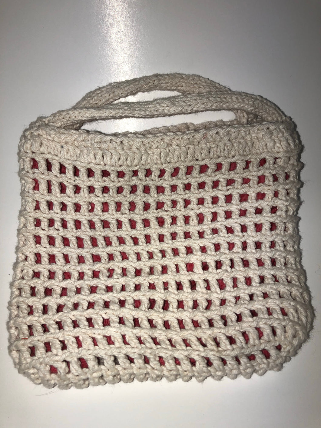White knit bag with pink lining