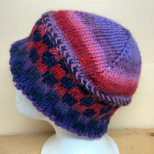 A checkerboard of purple-rich red-lavender alternating with navy: wool and alpaca, nice and soft